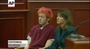 Colorado movie theater shooting suspect James Holmes, 24, showed little emotion as he made his first court appearance handcuffed with reddish orange hair. He was wide-eyed and frowning as he sat staring down, closing his eyes at one point. 