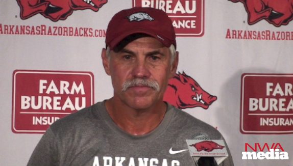 Arkansas defensive ends coach Steve Caldwell recaps the Razorbacks' practice on Friday. 