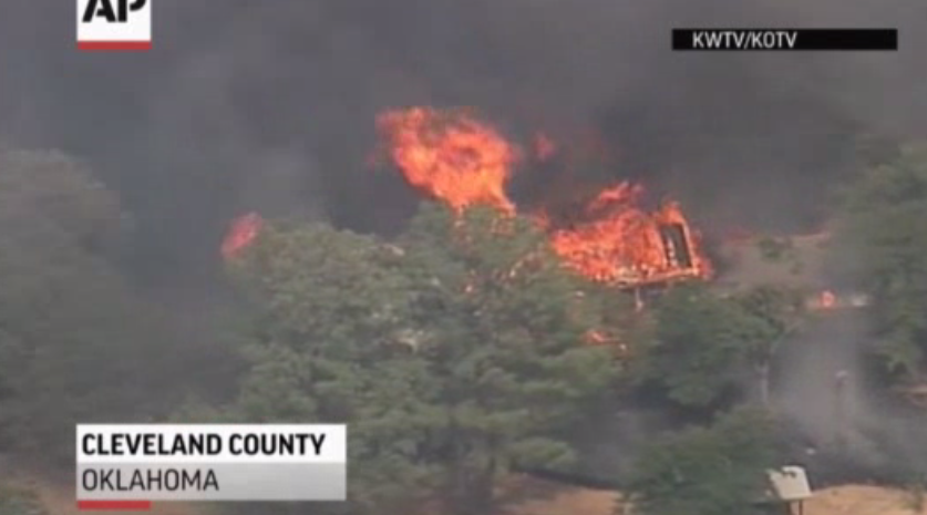 A wildfire stirred by high winds sweeping through rural woodlands just south of the Oklahoma City area has set at a number of homes on fire.