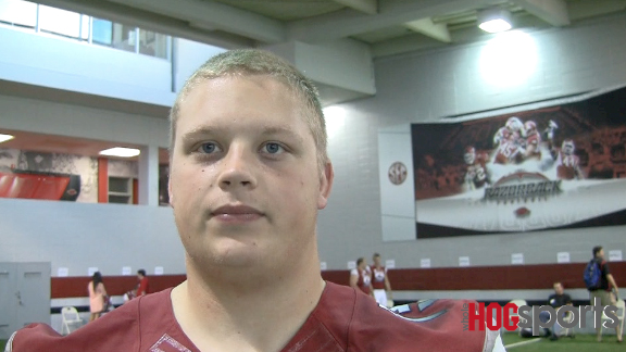 Arkansas freshman offensive lineman Jeremy Ward talks during the Razorbacks' media day in Fayetteville. 