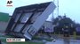 Hurricane Isaac pushed water over a rural levee to flood some homes, knocked out power and immersed beach-front roads in Louisiana and Mississippi early Wednesday, Aug. 29, 2012.