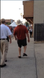Benton County Judge Bob Clinard walking with sheriff's deputies at Frisco Fest.