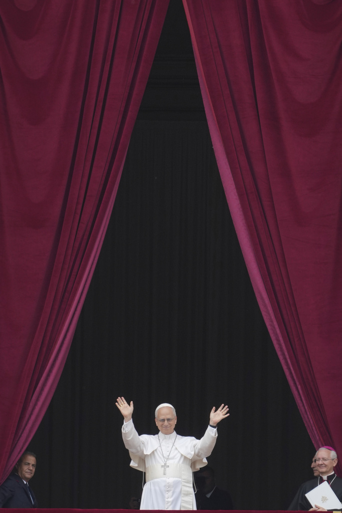 Pope Leo XIV appears at the central balcony of St. Peter's Basilica on May 11, 2025, for his first Sunday blessing after his election, in St. Peter's Square at the Vatican. (AP Photo/Andrew Medichini)