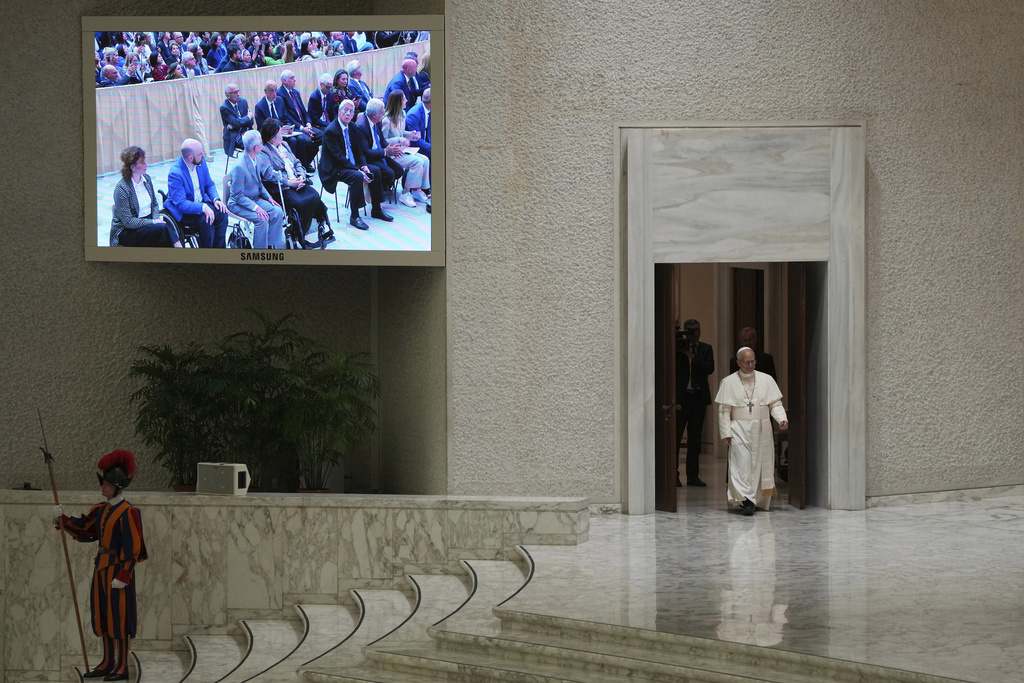 Pope Leo XIV arrives May 12, 2025, to meet with members of the international media in the Paul VI Hall at the Vatican. (AP Photo/Domenico Stinellis)