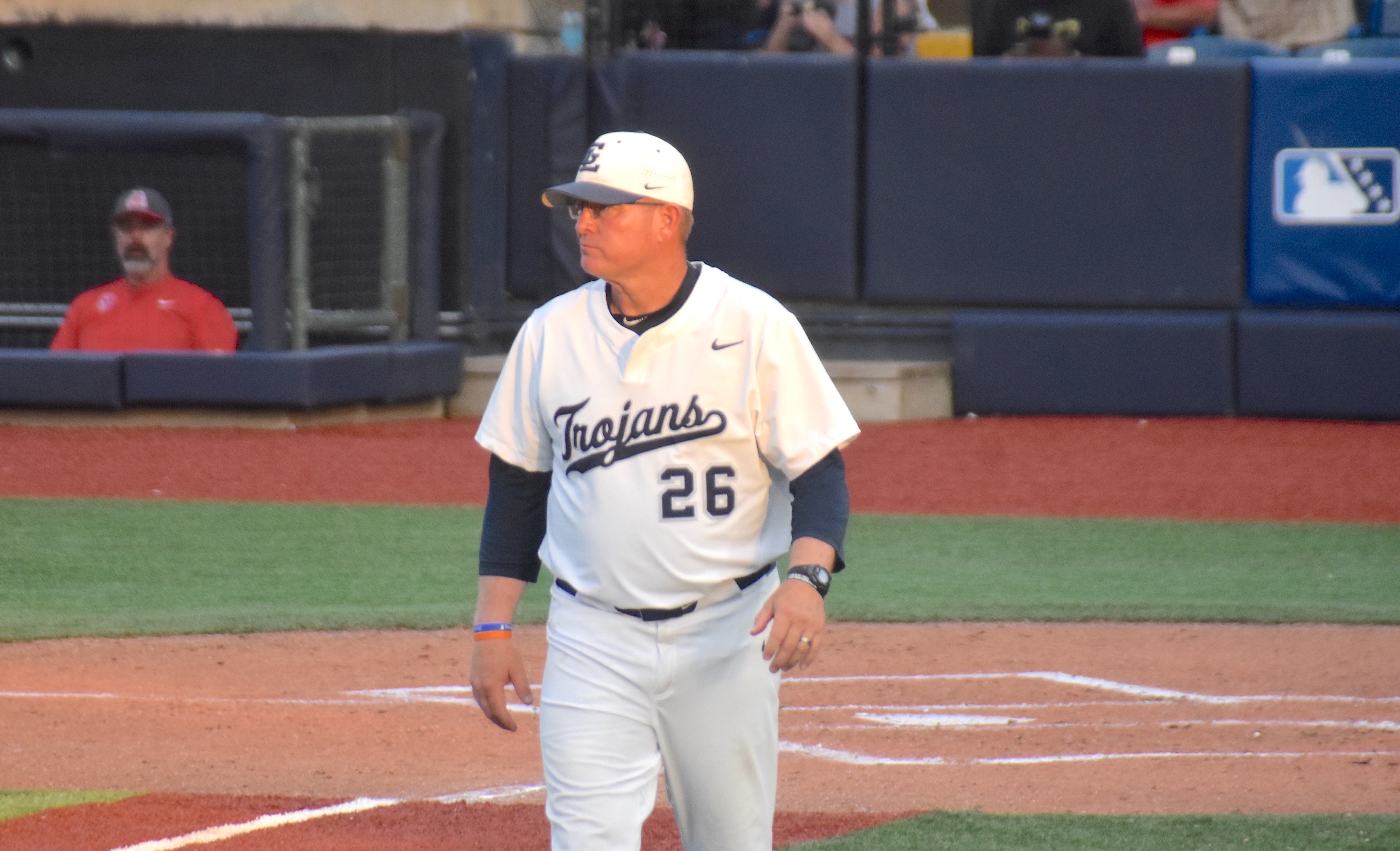 Staff photo by Patrick MacCoon / Gordon Lee head coach Mike Dunfee walks back to the third base box during Game 2 of Monday's GHSA Class 1A state championship against Pepperell at AdventHealth Stadium in Rome, Ga.