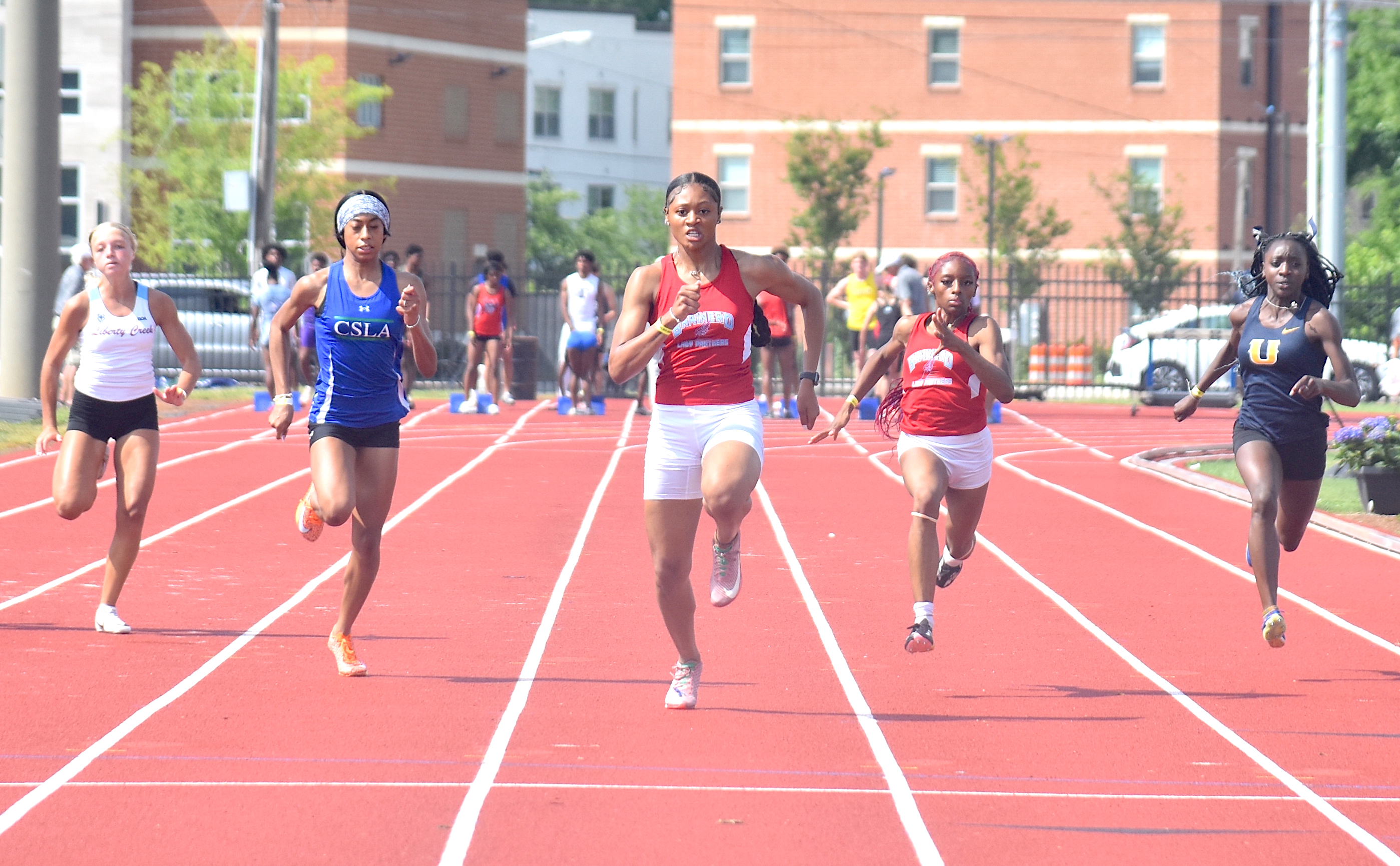 Staff photo by Patrick MacCoon / Brainerd senior Danielle Dunning, center, wins her fourth consecutive TSSAA Class A state championship in the 100-meter dash on the first day of the Spring Fling Tuesday in Murfreesboro.
