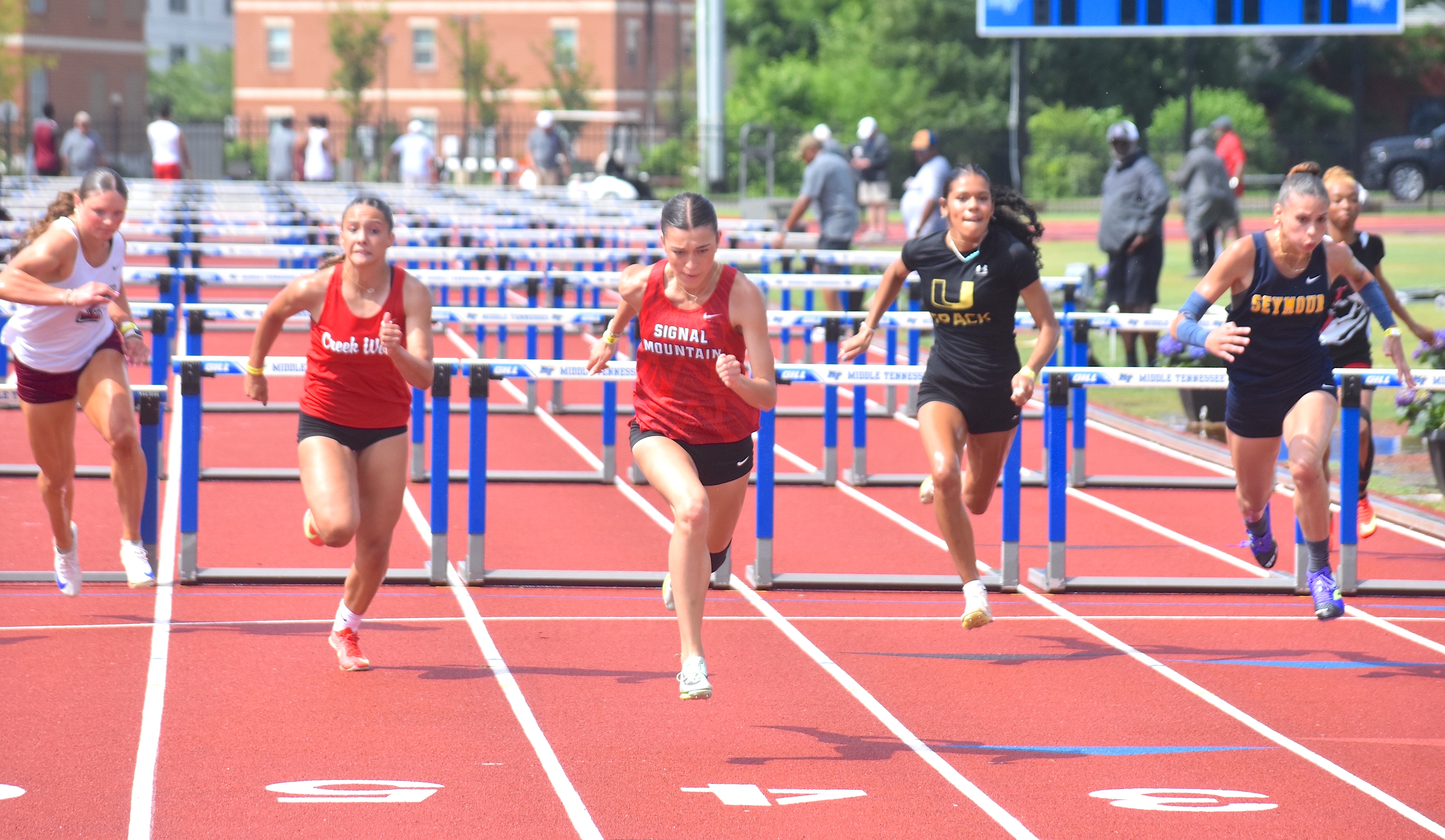Staff photo by Patrick MacCoon / Signal Mountain's Marlee Burkley, center, wins a state championship in the TSSAA Class A 100-meter hurdles on the first day of the Spring Fling Tuesday in Murfreesboro.