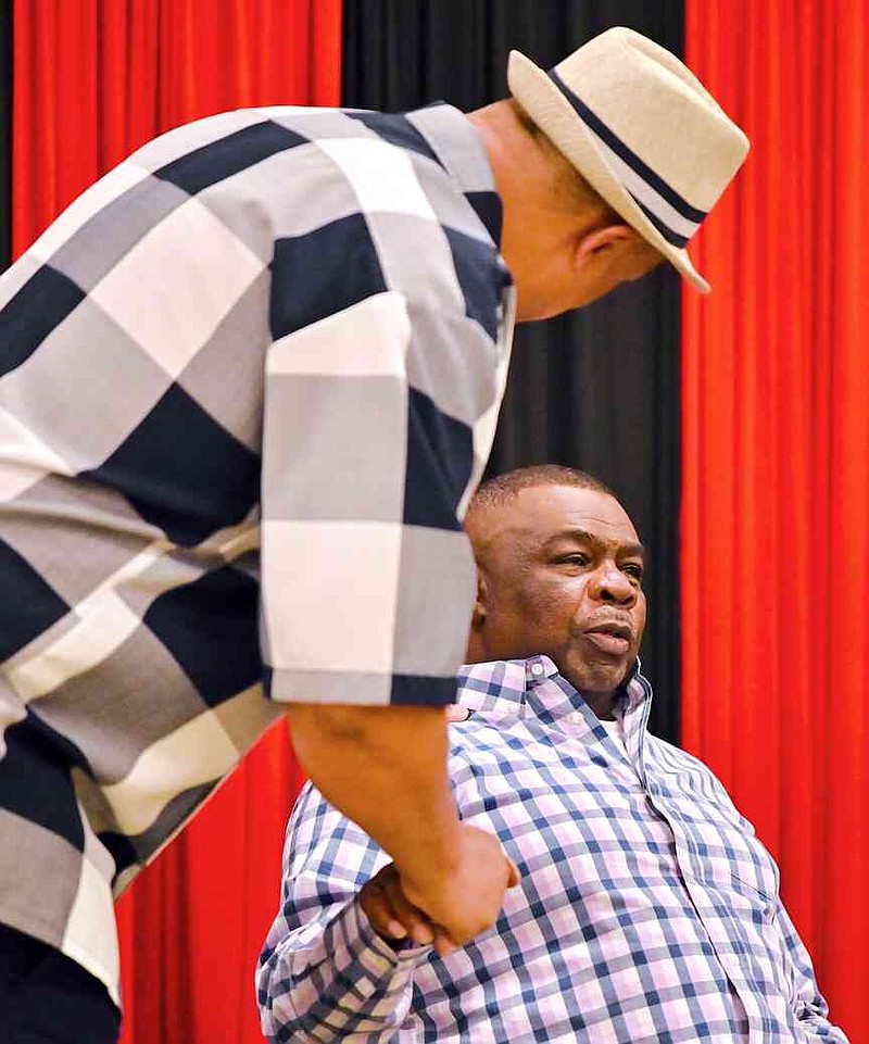 Terry Rogers shakes hands with a guest after a ceremony renaming the Recreation Center, 1 Legion Drive, as the Terry Lee Rogers Recreation Center on Friday, May 30, 2025, in Texarkana, Ark. Scores filled the gym at the center in a show of support for Rogers — a longtime supporter of local youth sports. Refreshements, including small cakes, were served after the ceremony. (Staff photo by Stevon Gamble)