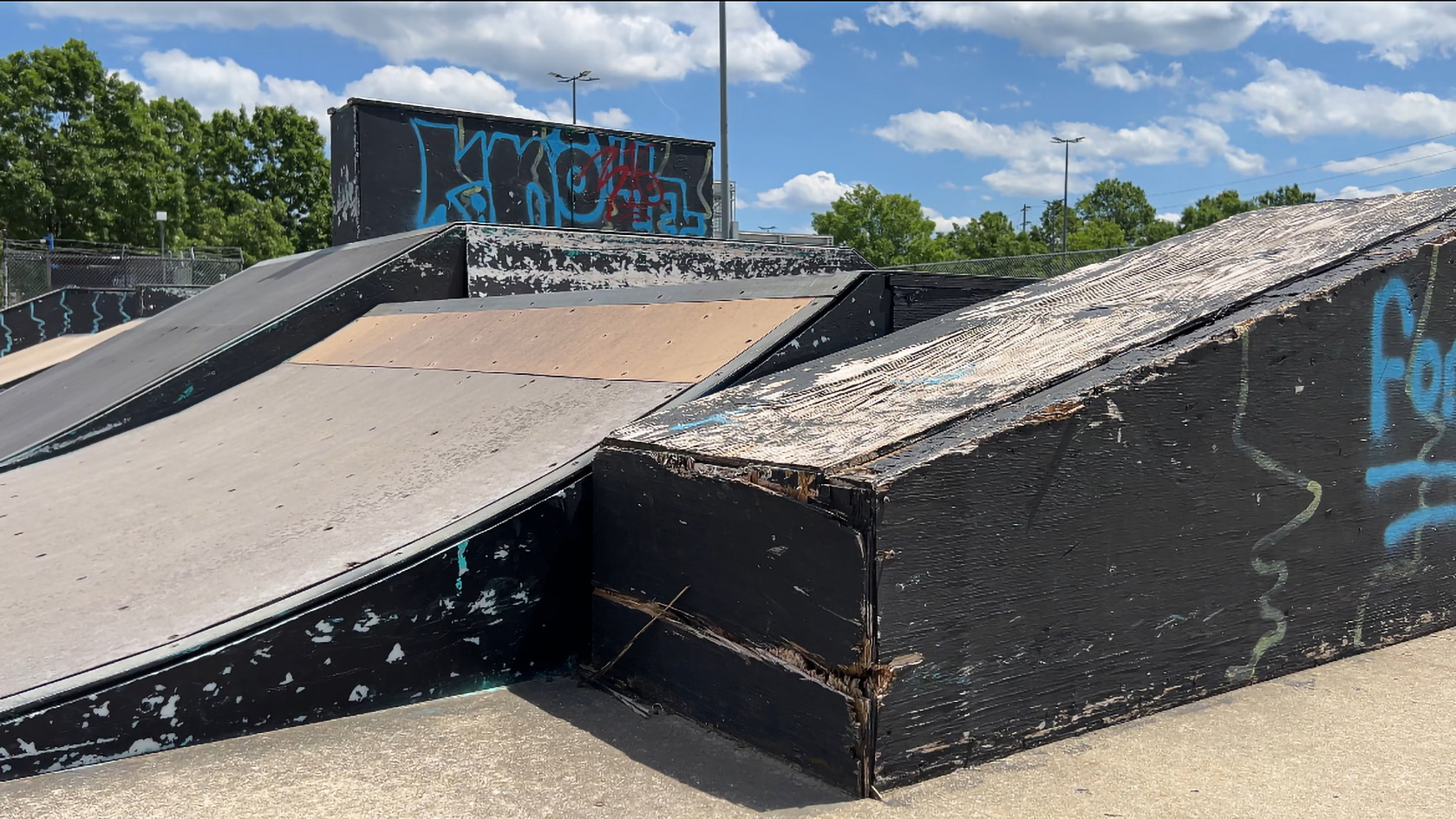 Staff photo by Cassandra Castillo / A ramp with chipping wood and fading paint is seen on May 21, 2025. The Chattanooga Skate Park renovation has been postponed for the second time, drawing concerns from the skater community.