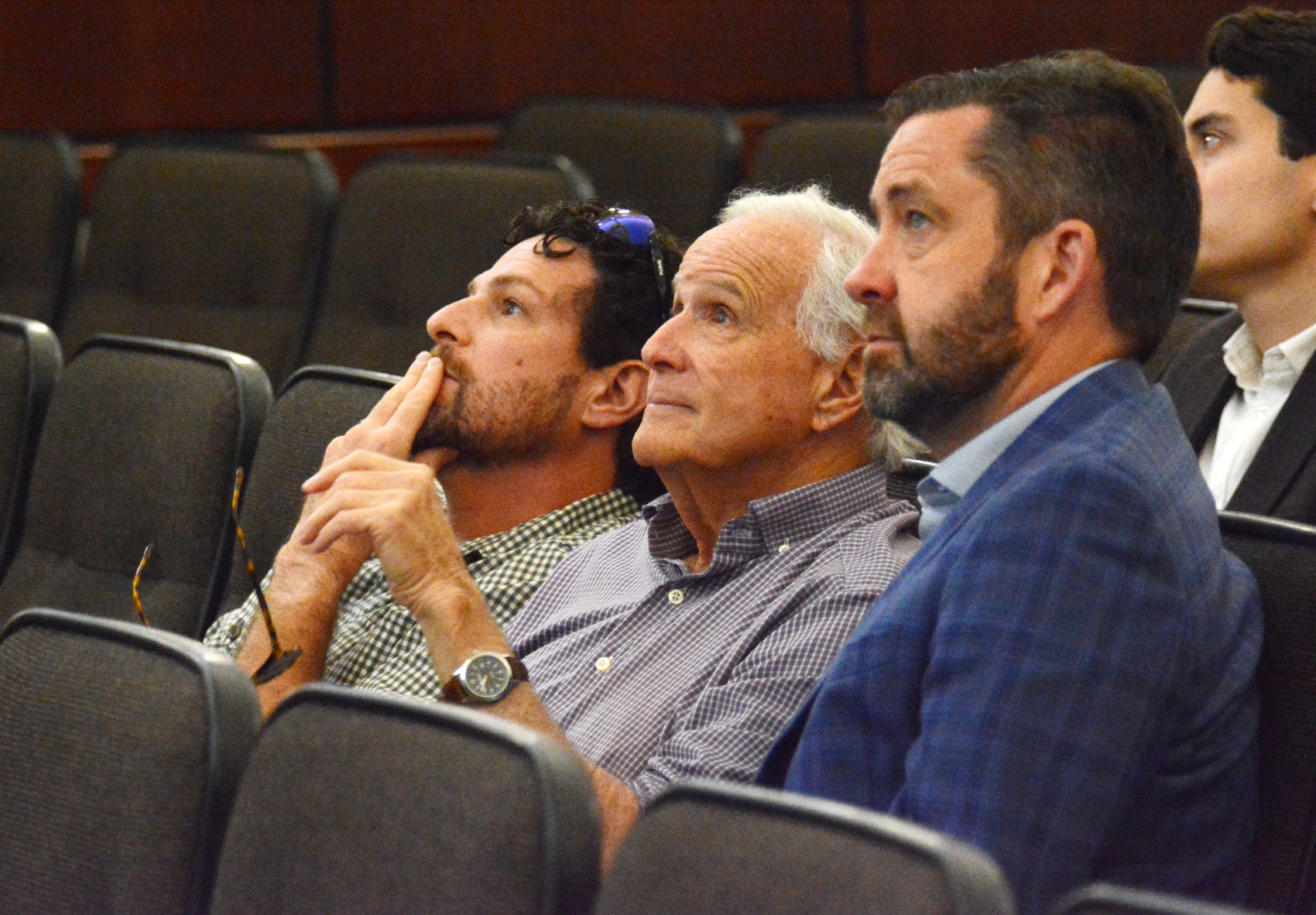 Staff Photo by Robin Rudd / From left, Andy Stone of Perimeter Properties; Gary Chazen, president of Perimeter Properties; and Todd Womack, president and CEO of Bridge Public Affairs, watch a stadium presentation June 12, 2025, during a meeting of the Chattanooga-Hamilton County Sports Authority Board.