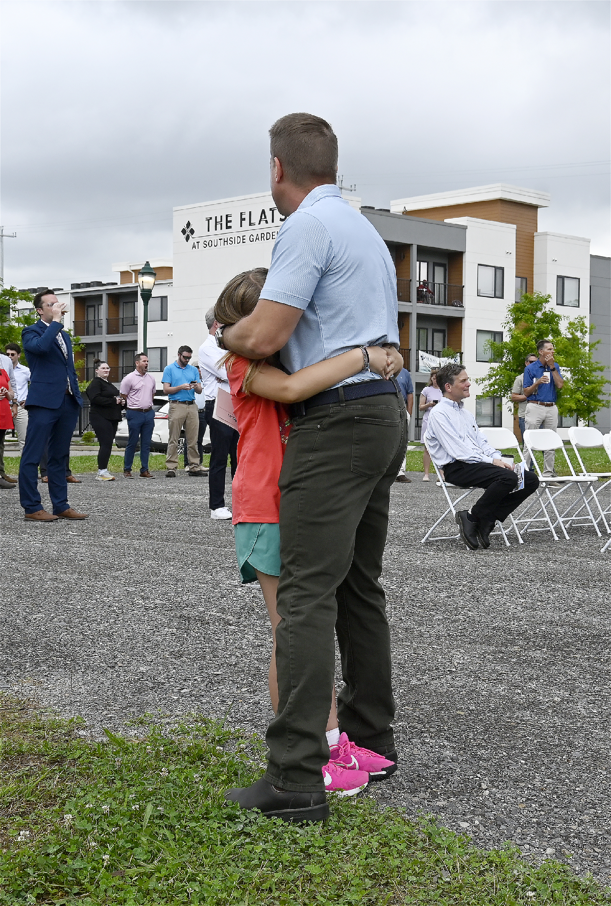 Staff photo by Abby White / FTC Development CEO Matt McGauley hugs his daughter, Claire McGauley, 8, after the Broadview groundbreaking ceremony June 16, 2025.