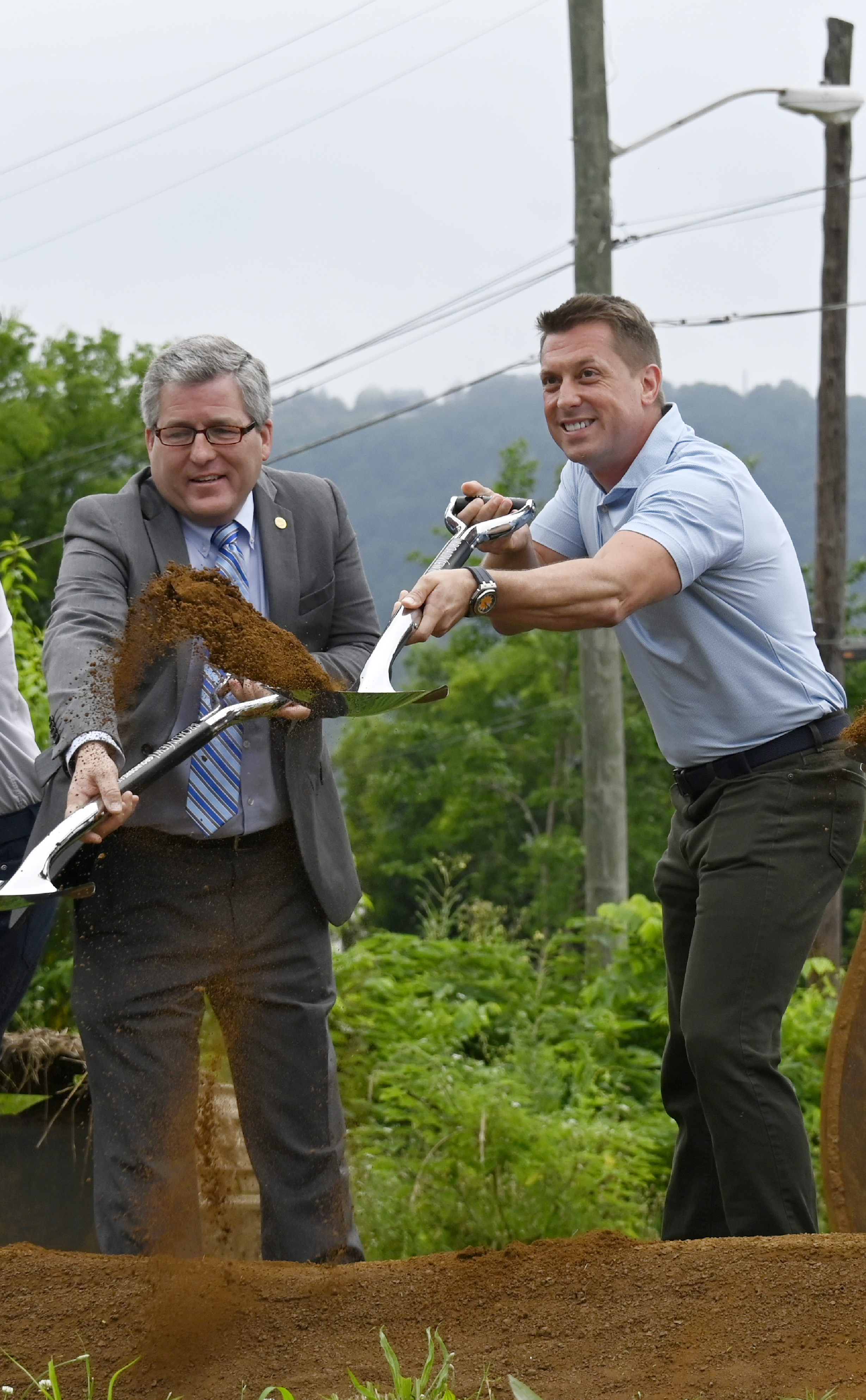 Staff photo by Abby White / Hamilton County Commissioner Joe Graham, left, and FTC CEO Matt McGauley toss dirt at the new Broadview development June 16, 2025.