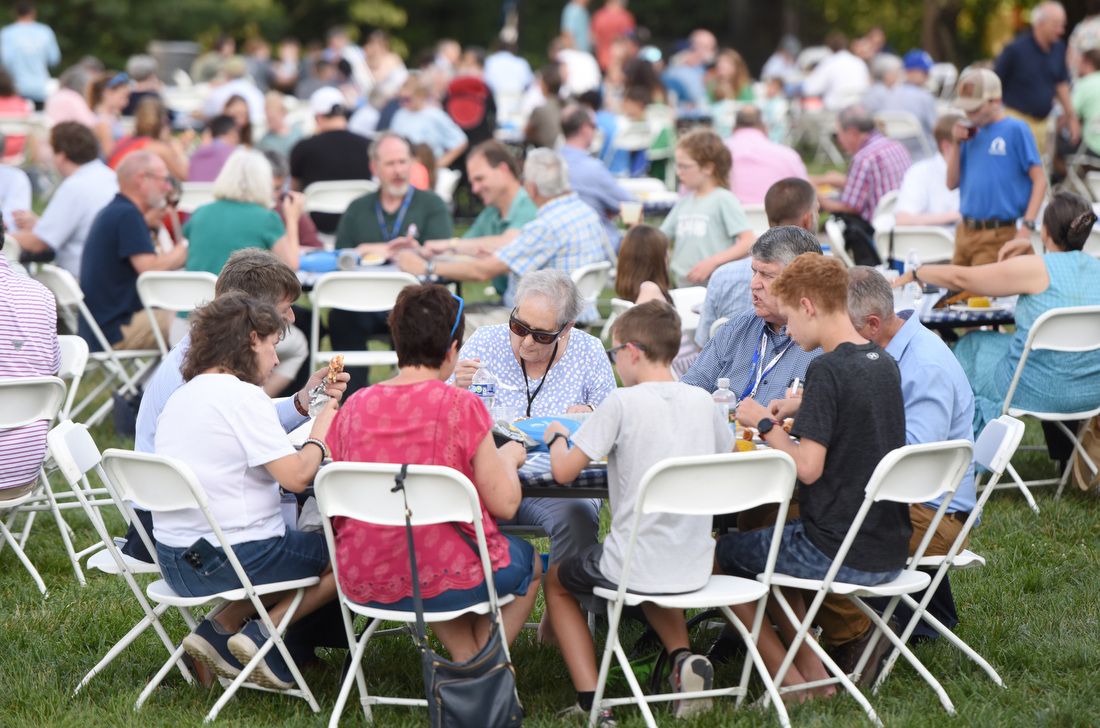 Staff photo by Matt Hamilton / Visitors enjoy a barbecue meal June 25, 2025, during an outdoor picnic at Covenant College in Lookout Mountain, Ga.