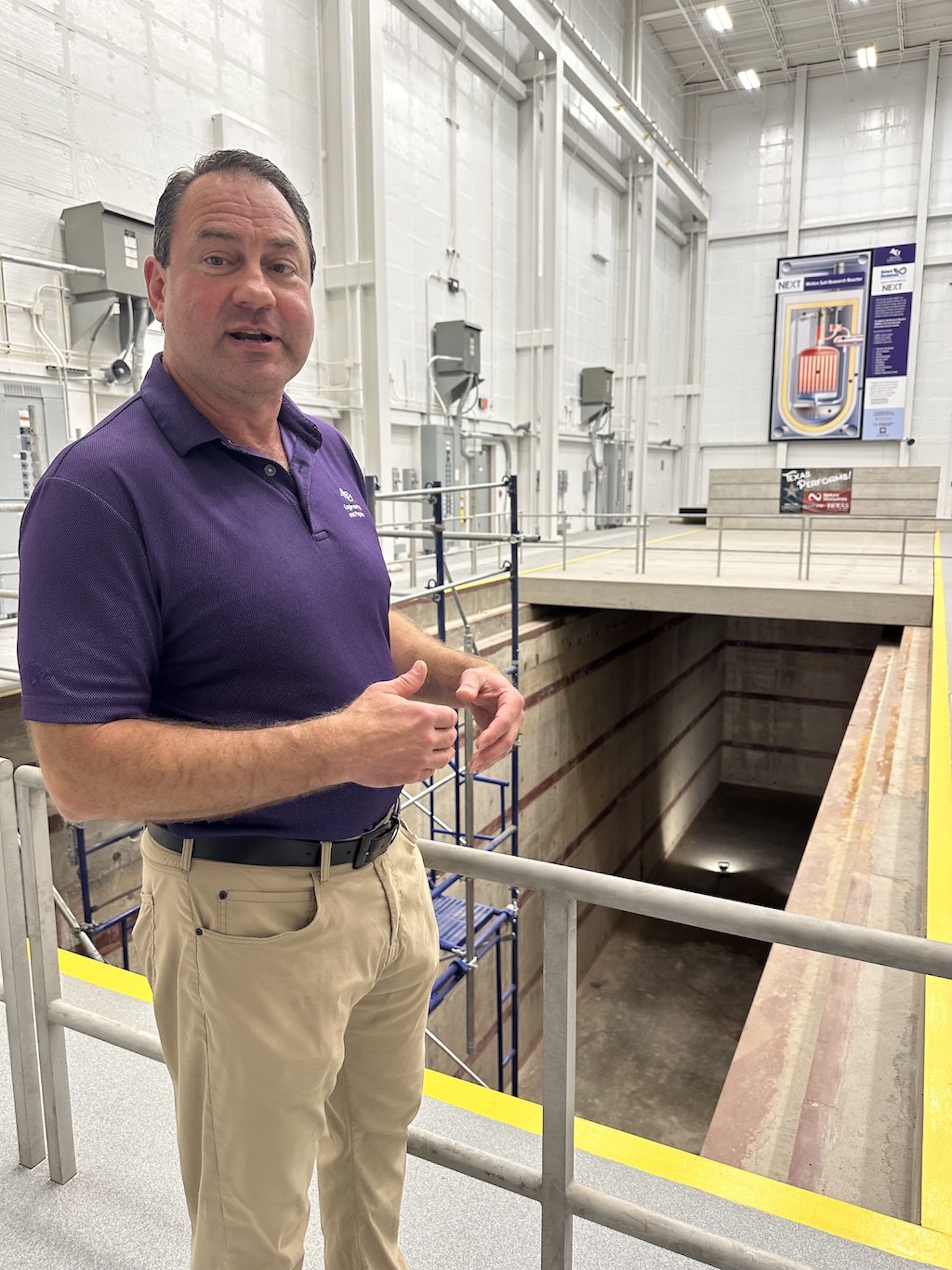 Rusty Towell, a professor at Abilene Christian University, inspects a 25-foot-deep trench inside a research center at the Texas university. (David Montgomery/Stateline)
