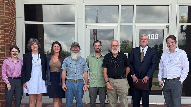 Petitioners from Alabama environmental groups pose for a photo on June 13, 2025, outside the Alabama Department of Environmental Management headquarters in Montgomery, Ala. From left: Katie Holmes and Eva Dillard, Black Warrior Riverkeeper; Justinn Overton, Coosa Riverkeeper; Nelson Brooke, Black Warrior Riverkeeper; David Butler, Cahaba Riverkeeper; Michael Mullen, Choctawhatchee Riverkeeper; David Ludder; Charles Miller, Alabama Rivers Alliance. (Inside Climate News)