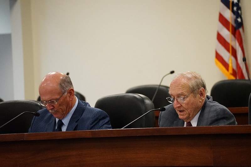 John McMillan, right, executive director of the Alabama Medical Cannabis Commission, takes a vote on rescinding all awarded medical cannabis licenses and denials at a meeting in Montgomery on Oct. 26, 2023. (Alander Rocha/Alabama Reflector)