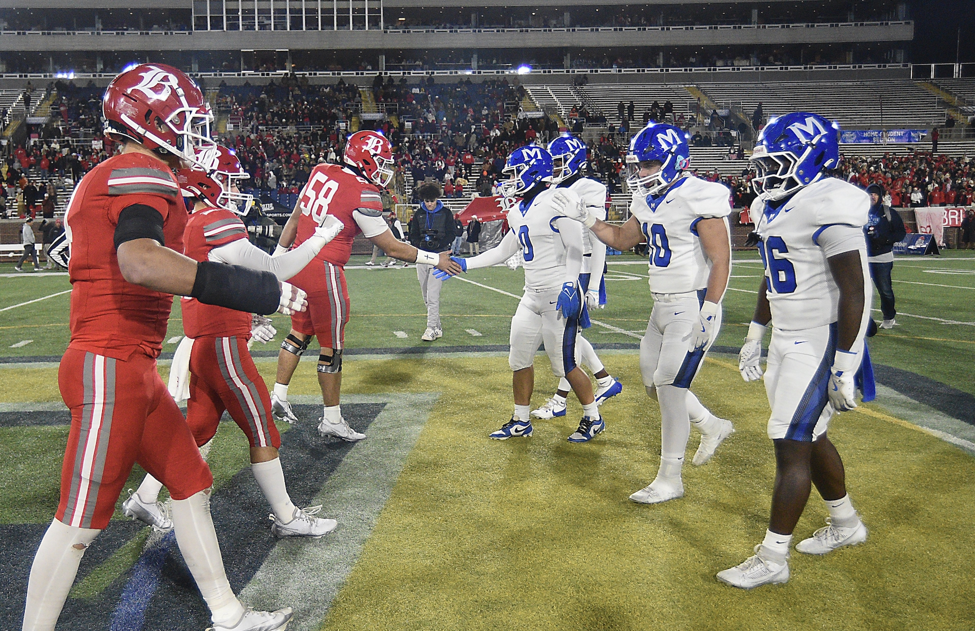 Staff photo by Matt Hamilton / Baylor and McCallie players shake hands before the coin toss at midfield during last December's TSSAA Division II-AAA BlueCross Bowl state championship game at Finley Stadium.