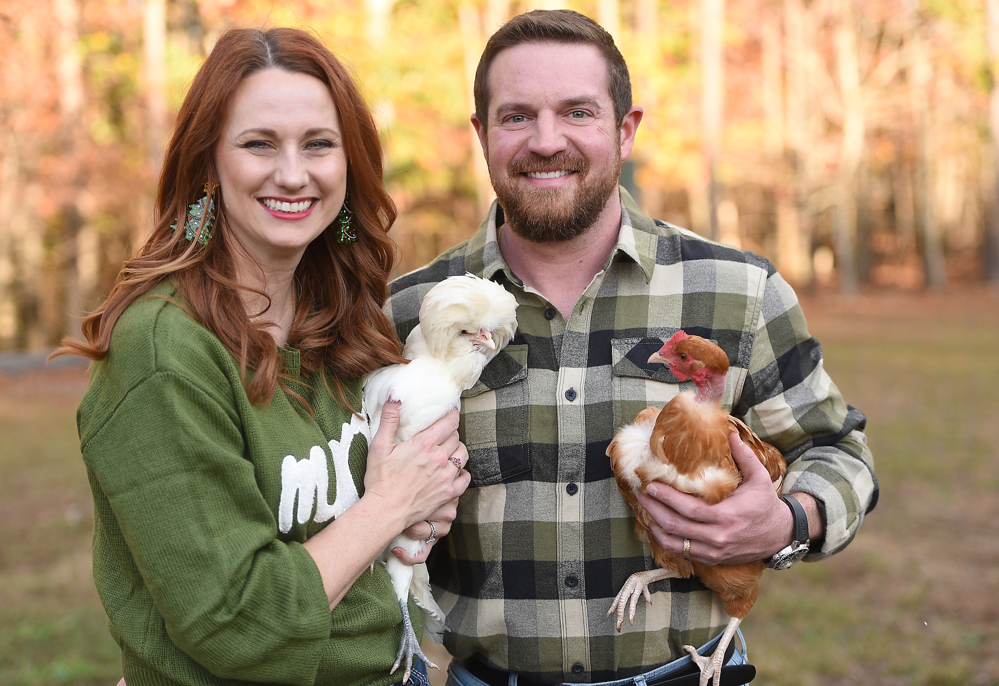 Staff photo by Matt Hamilton / Vanessa and Jonathan Trent hold two of their chickens at their home Nov. 8, 2024, in Graysville, Tenn.