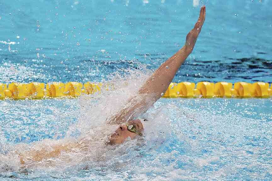 Marchand might be French but he led a Texas-flavored moment at the swim worlds