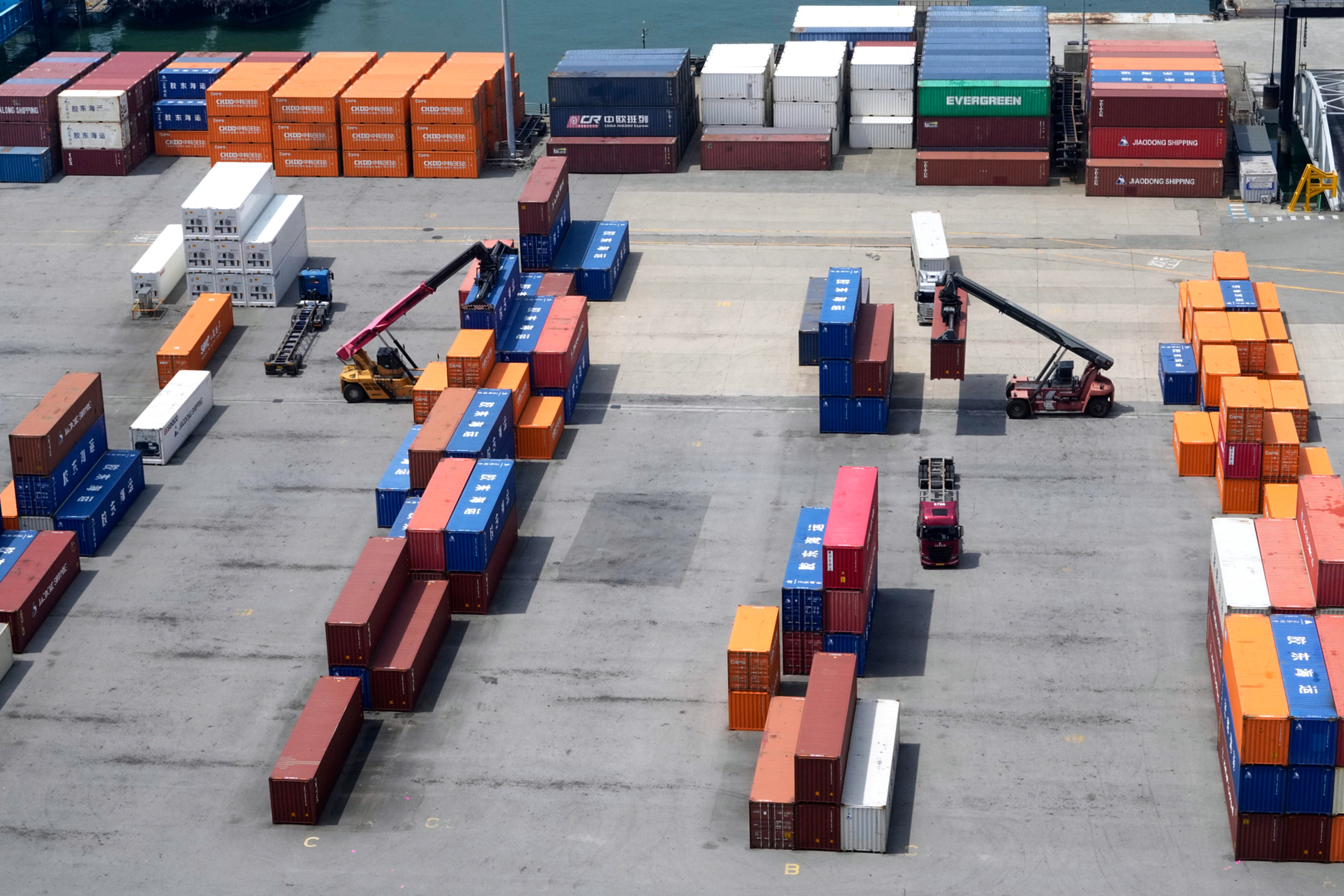 Cranes and shipping containers are seen at a port in Pyeongtaek, South Korea, Friday, Aug. 1, 2025. (AP Photo/Ahn Young-joon)
