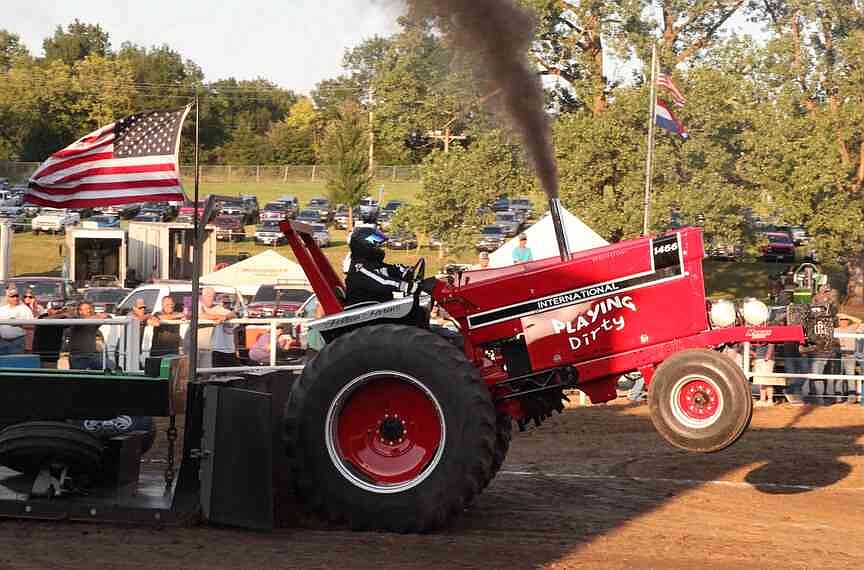 Tractors and trucks tear up dirt track