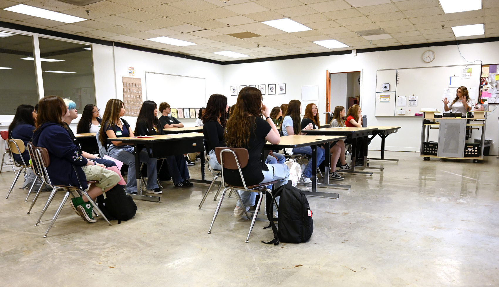 Staff photo by Abby White / Tessa Buttram, right, speaks to her first class of freshmen. North River Future Ready Center, formerly Sequoyah High School, held its first day of classes Aug. 6, 2025, and became the second campus in Hamilton County to become a centralized hub for career and technical education.
