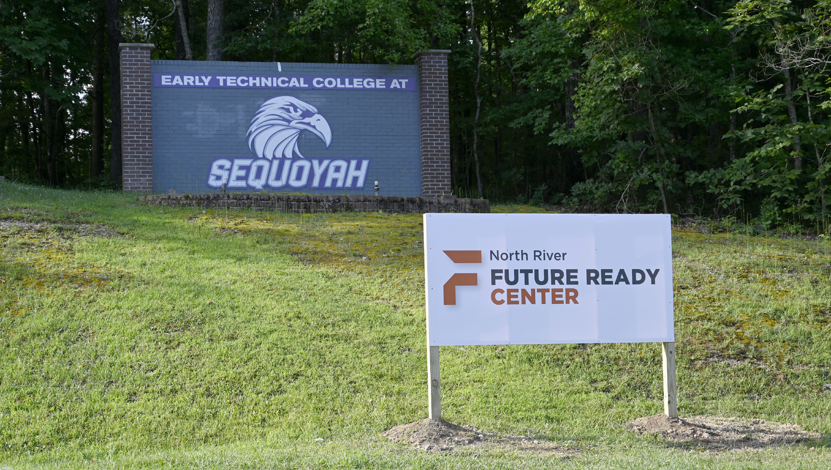 Staff photo by Abby White / A North River Future Ready Center sign is pictured in front of a Sequoyah High School sign. North River Future Ready Center, formerly Sequoyah High School, held its first day of classes Aug. 6, 2025, and became the second campus in Hamilton County to become a centralized hub for career and technical education.