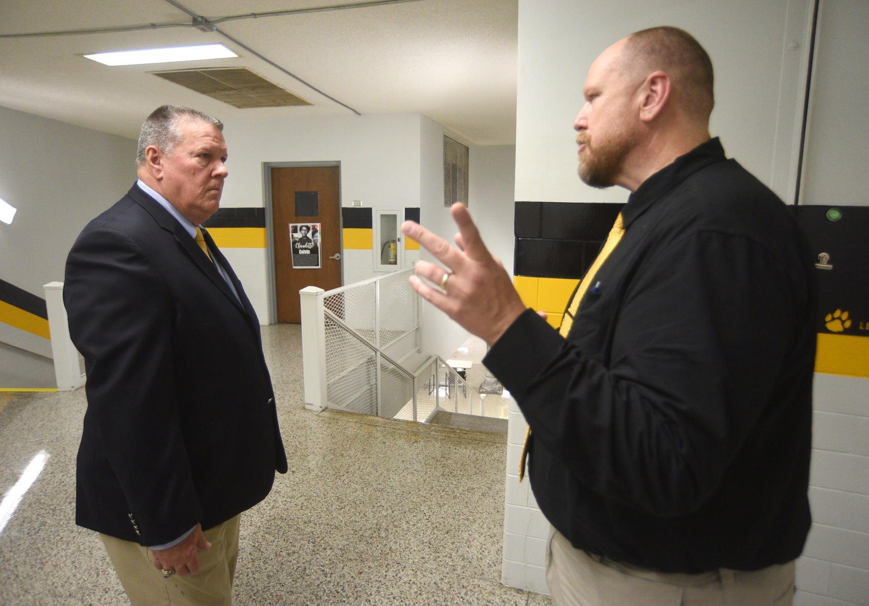 Staff photo by Matt Hamilton/ Principal Daniel Lunt, right, talks with former Principal Lee Ziegler on Aug. 6, 2025, the first day of the new school year at Hixson High School and in the Hamilton County system. Ziegler is now the North River community superintendent over the school.