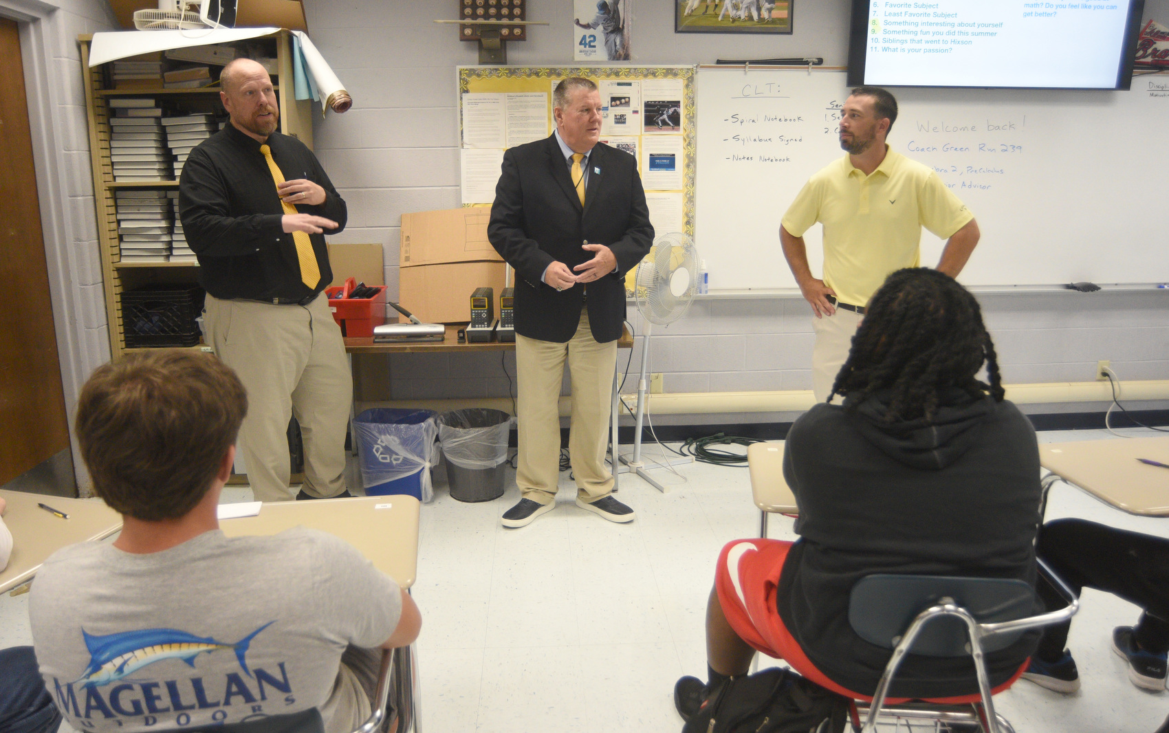 Staff photo by Matt Hamilton / Principal Daniel Lunt, left, and North River Community Superintendent Lee Ziegler, middle, talk to students in a class taught by Colton Green, right, on Aug. 6, 2025, the first day of the new school year at Hixson High School and in the Hamilton County system.