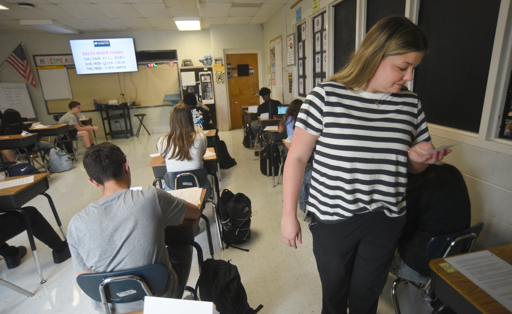 Staff photo by Matt Hamilton/ On Aug. 6, 2025, Algebra I teacher Rhiannon Brandenburg looks over cards filled out by freshmen with a list of things they are excited about and nervous about. Aug. 6 was the first day of the new school year at Hixson High School and in the Hamilton County system.