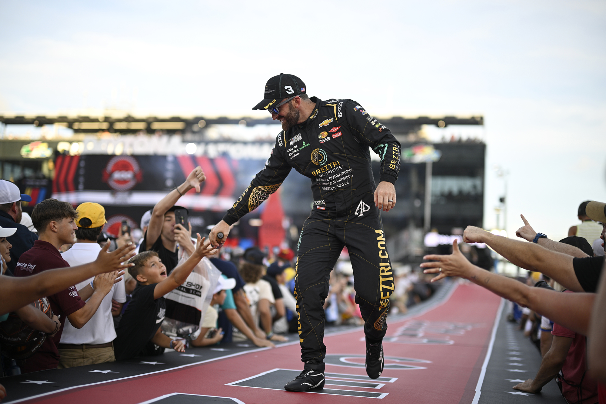 AP photo by Phelan M. Ebenhack / Austin Dillon interacts with spectators during driver introductions before the 2024 NASCAR Cup Series regular-season finale at Daytona International Speedway last August in Daytona Beach, Fla.