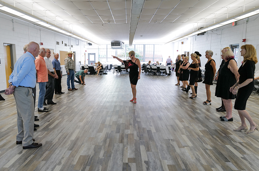 Photo by Mark Gilliland / Members of the dance club learn some new moves.