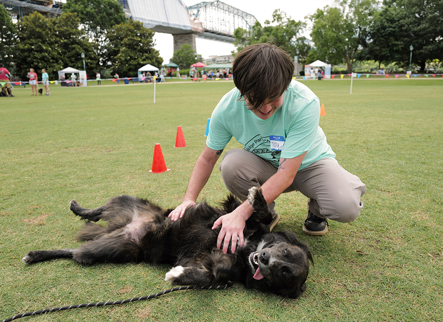 Photo by Mark Gilliland / Tizzy Smith gives Maya a belly rub.