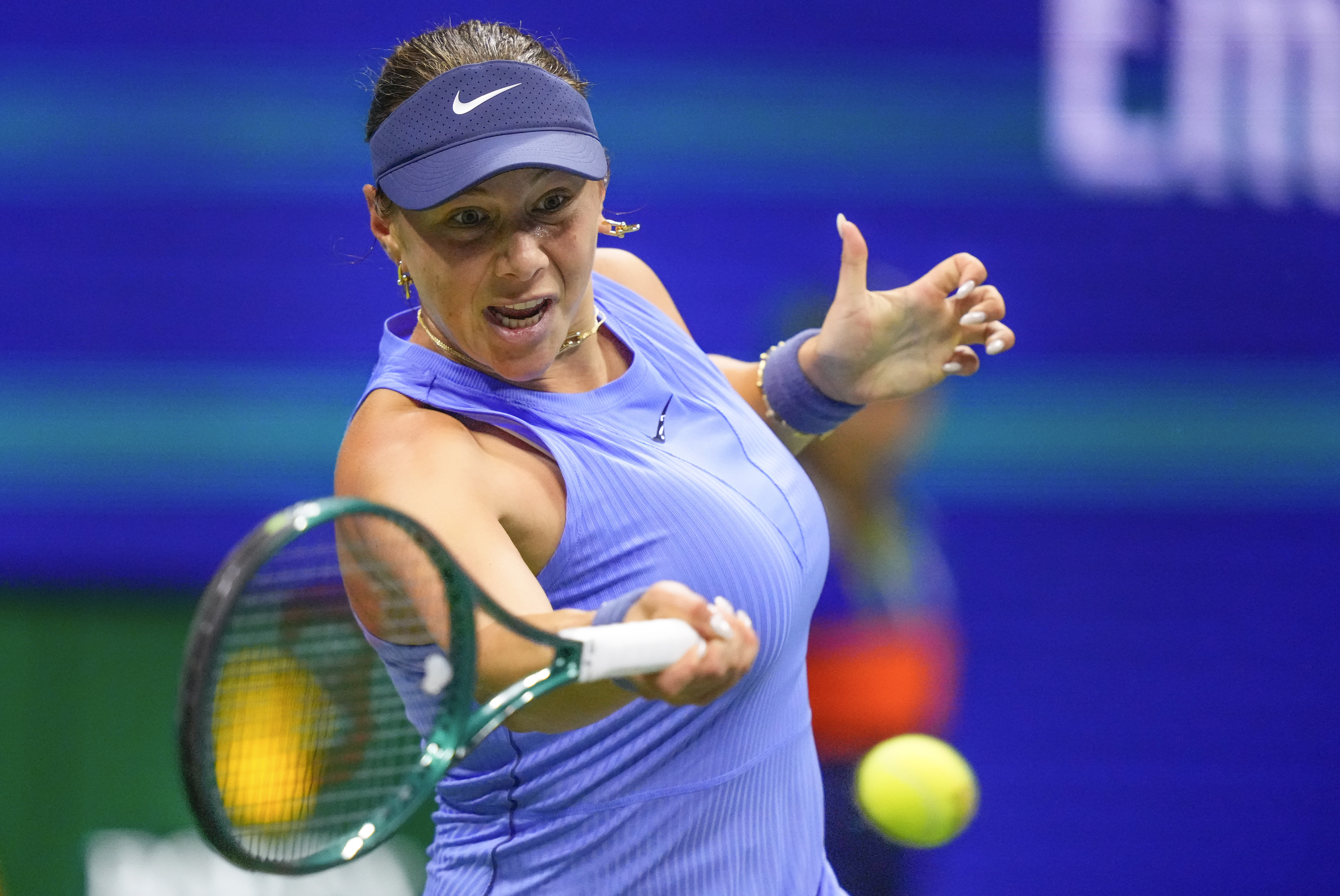 AP photo by Yuki Iwamura / Amanda Anisimova returns a shot to Naomi Osaka in a U.S. Open semifinal Thursday night in New York.