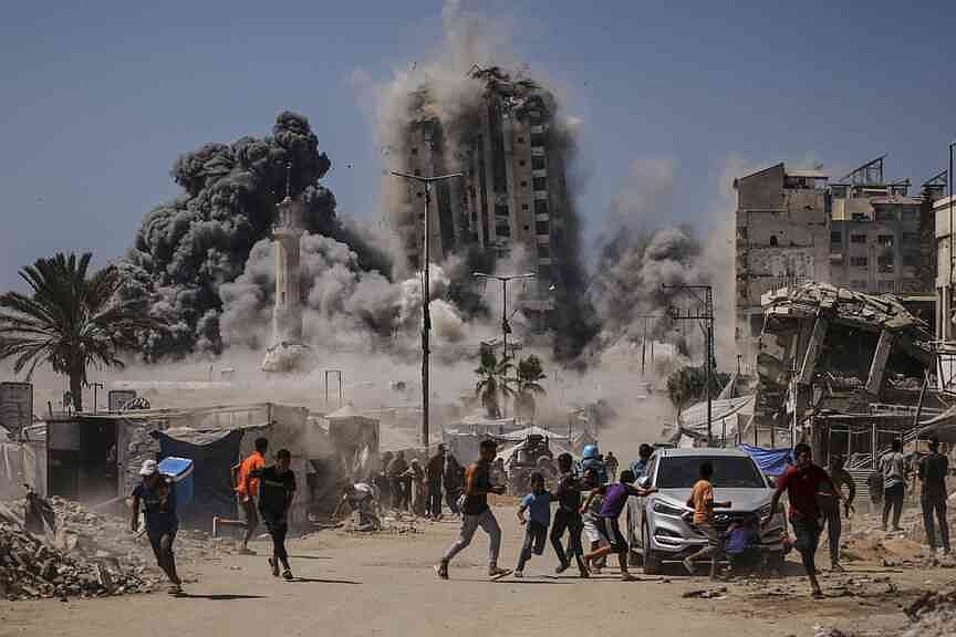 Israel strikes high-rise building in Gaza City, threatens to hit more