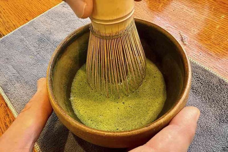 Senior Tea Buyer Aaron Vick uses a whisk to make a matcha drink inside The G.S. Haly Company's tea tasting room in Redwood City, Calif., Wednesday, Sept. 10, 2025. (AP Photo/Haven Daley)