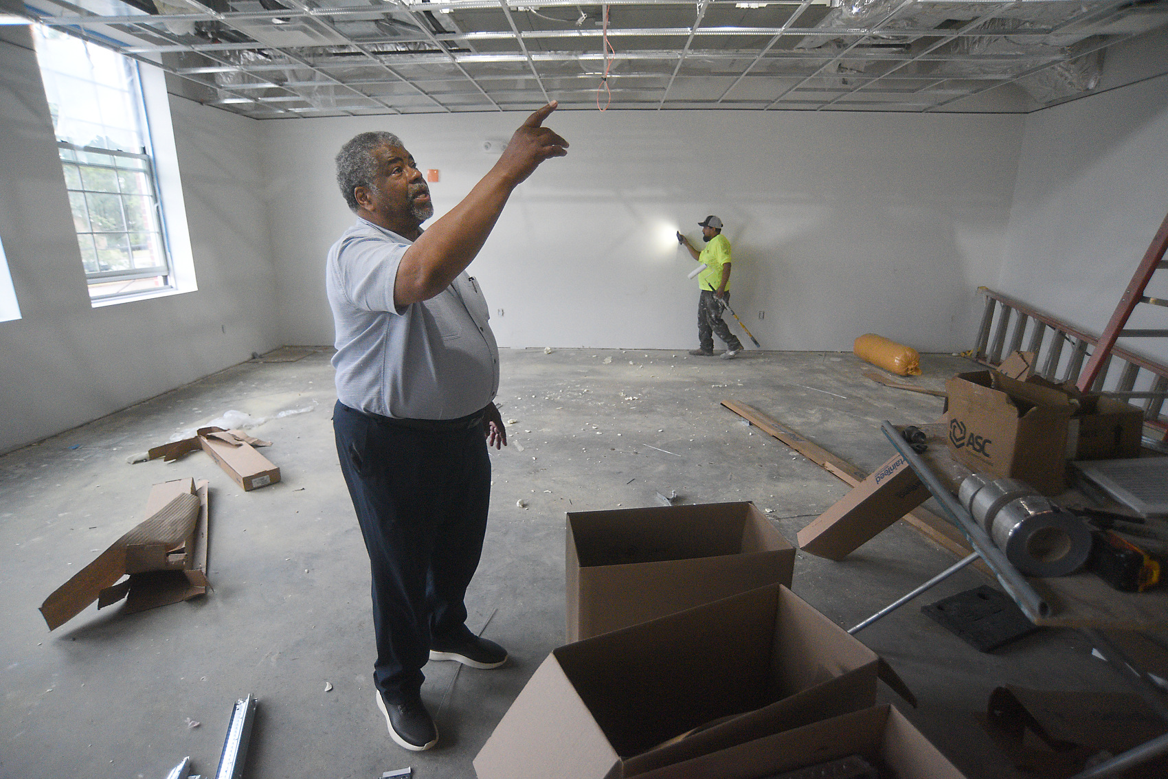 Staff photo by Matt Hamilton / On Sept. 23, 2025, architect Reginald Ruff leads a tour of the James A. Henry building.