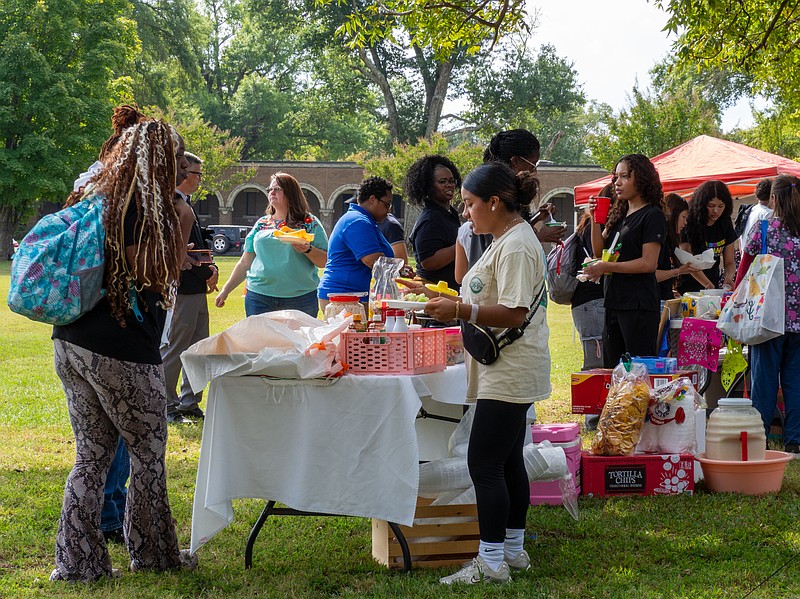 Attendees ordering traditional Mexican snacks, such as prepared chicharon and horchata water, are seen at the Hispanic Heritage Month Festival on Tuesday, Sept. 30, 2025, at Texarkana College. (Staff photo by Andrea Loredo)