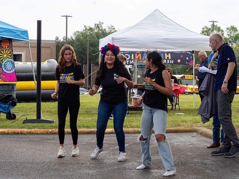 Volunteer Millie Serrano teaches students how to dance cumbia during the Hispanic Heritage Month Festival on Tuesday, Sept. 30, 2025, at Texarkana College. (Staff photo by Andrea Loredo)