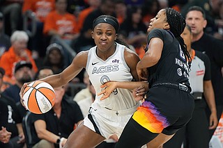 AP photo by Rick Scuteri / Las Vegas Aces guard Jackie Young drives as Phoenix Mercury guard Monique Akoa Makani defends during Game 3 of the WNBA Finals on Wednesday.