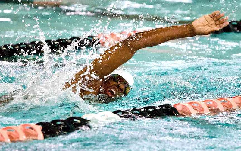 Texas High School Tigershark Kason Tate takes a breath as he competes in a heat of the boys 200-meter freestyle at a four-school meet Saturday, Oct. 18, 2025, at the Texarkana Independent School District Aquatic Center at Texarkana College. The Tigersharks hosted Ranchview High School, Newman Smith High School and R.L. Turner High School. Texas High boys finished first in the team rankings with 725 points. (Staff photo by Stevon Gamble)
