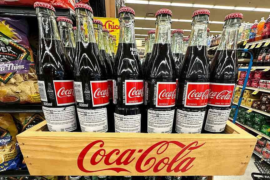 Premium drinks, mini cans help Coca-Cola boost third quarter results ...