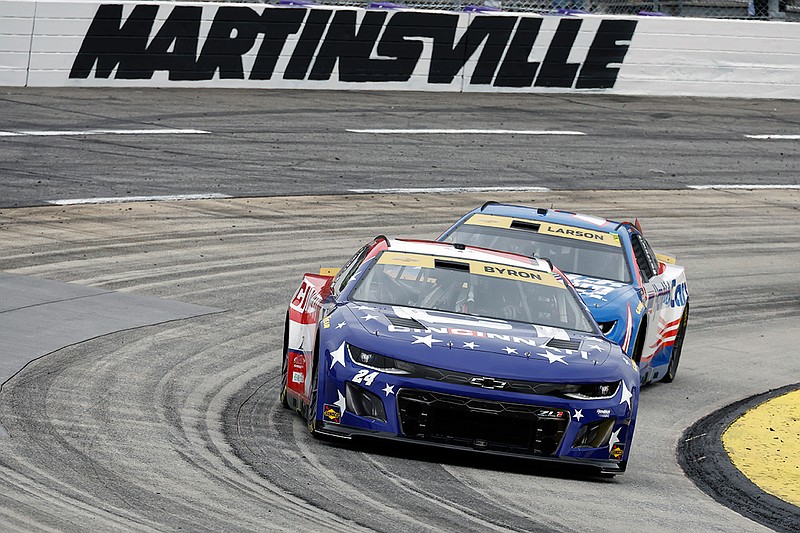 AP photo by Terry Renna / Hendrick Motorsports driver William Byron (24) leads teammate Kyle Larson out of a turn during a NASCAR Cup Series playoff race last Sunday at Virginia's Martinsville Speedway.