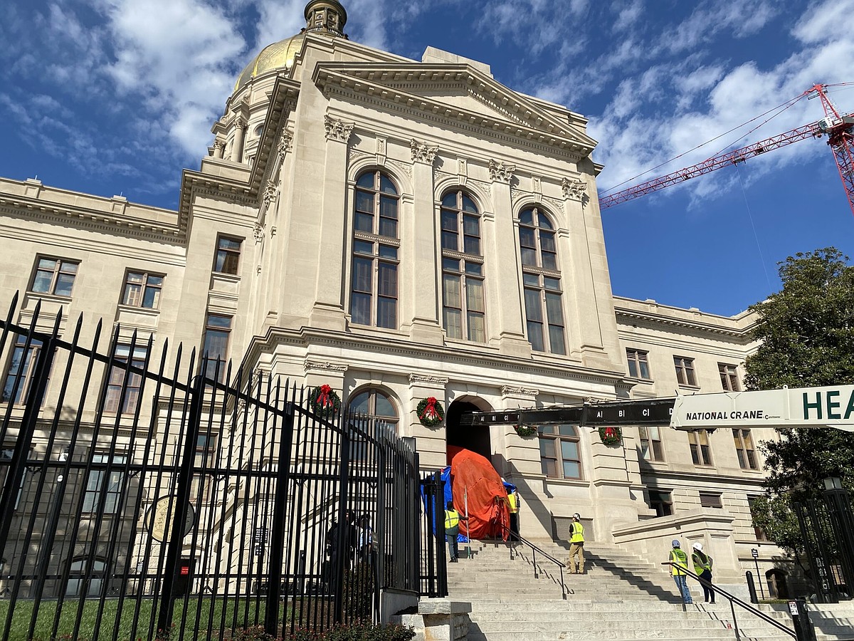 A 26-foot tree from Northwest Georgia makes the journey to the Gold Dome