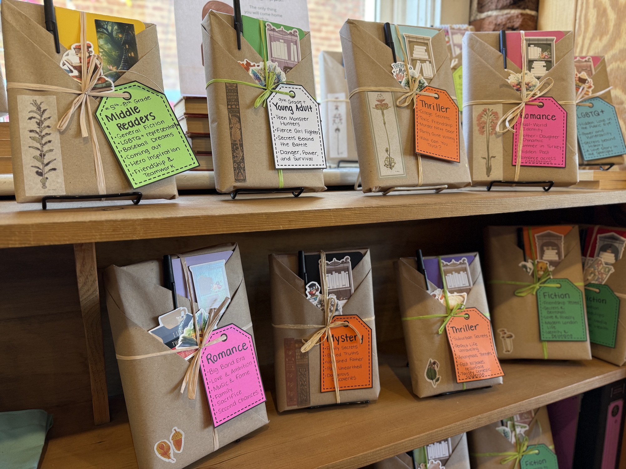 Staff photo by Sam Still / These books on the shelves at Winder Binder have been wrapped with brown paper to hide the books' titles so it is a surprise.