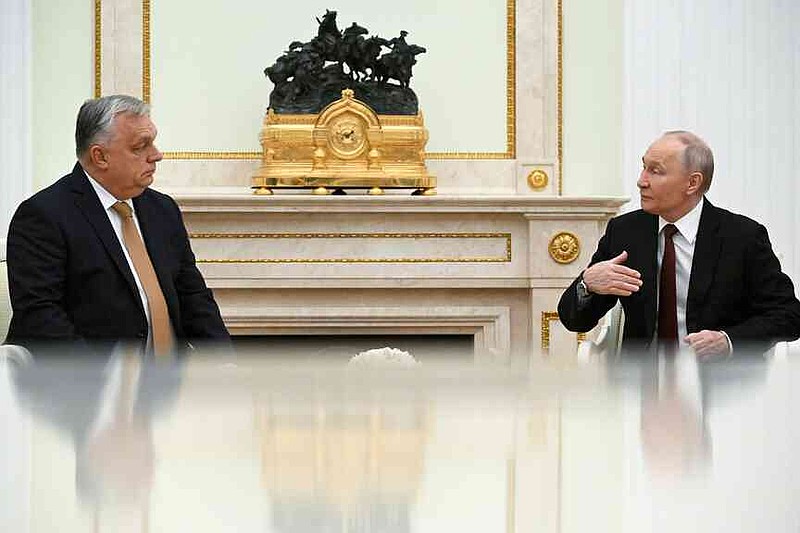 Russian President Vladimir Putin, right, speaks with Hungarian Prime Minister Viktor Orban during their meeting at the Senate Palace of the Kremlin in Moscow, Russia, Friday, Nov. 28, 2025. (Alexander Nemenov/Pool Photo via AP)