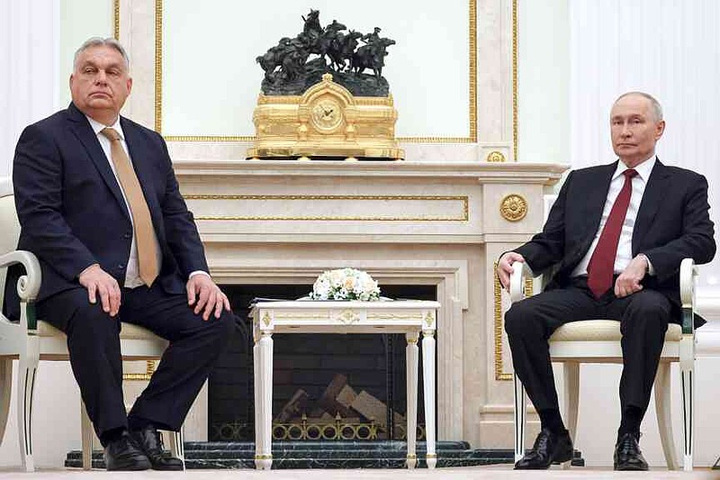 Russian President Vladimir Putin, right, attfinishs a meeting with Hungarian Prime Minister Viktor Orban at the Senate Palace of the Kremlin in Moscow, Russia, Friday, Nov. 28, 2025. (Vladimir Gerdo, Sputnik, Kremlin Pool Photo via AP)