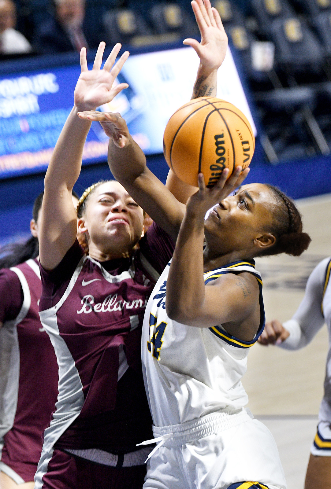 Staff Photo by Robin Rudd / UTC's Kalifa Ford (34) shoots under the basket. The University of Tennessee at Chattanooga Mocs hosted the Bellarmine Knights in a NCAA basketball game, at McKenzie Arena, on Dec. 7, 2025.