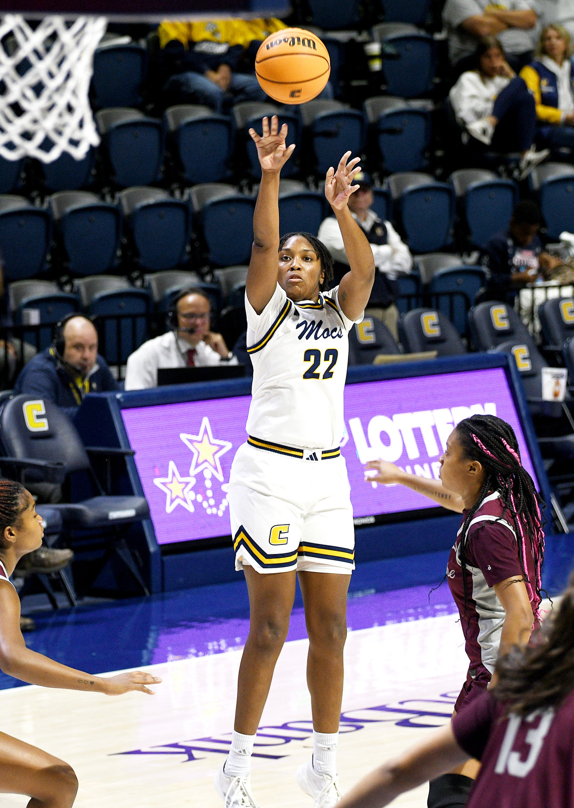 Staff Photo by Robin Rudd / UTC's Gianna Corbitt (22) shoots a three-point shot. The University of Tennessee at Chattanooga Mocs hosted the Bellarmine Knights in a NCAA basketball game, at McKenzie Arena, on Dec. 7, 2025.