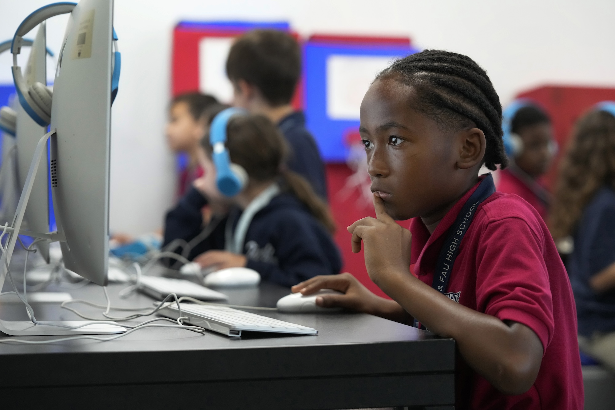 AP Photo by Wilfredo Lee / Michael Guerrier, 8, works on a computer, Monday, April 15, 2024, at A.D. Henderson School in Boca Raton, Fla.